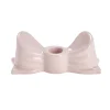 Bougeoir dolomite forme noeud coloré L14,5xH6cm (2 modèles rouge ou rose)