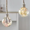 Suspension corde avec boule en verre déco led et fleurs artificielles
