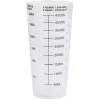Verre doseur en plastique blanc
